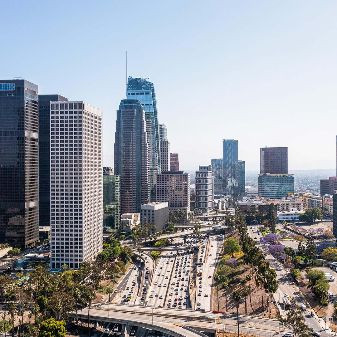 Los Angeles downtown skyline with freeway traffic during the day