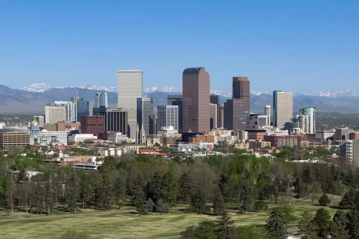 Downtown denver skyline with mountains on the horizon