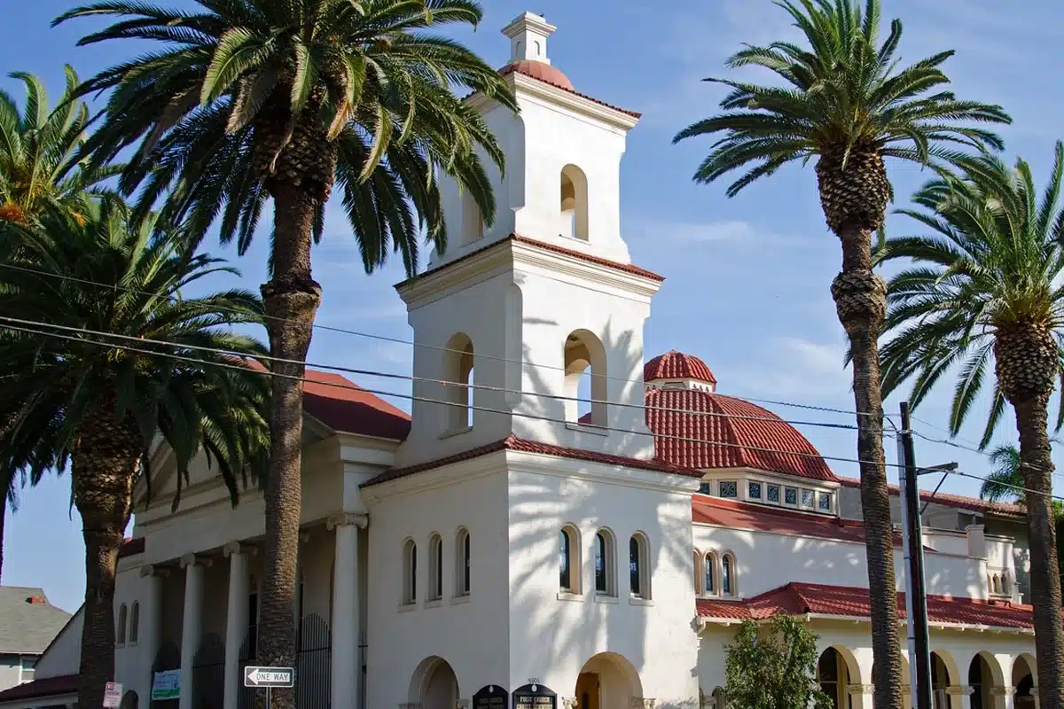 The first church of christ in riverside, framed by palm trees